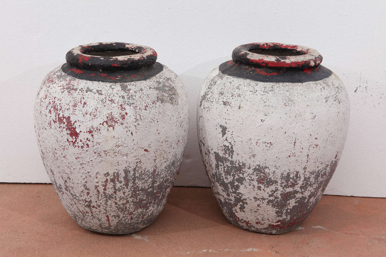 Pair of vintage 20's concrete pots with original patina.  Heavy, solid concrete pots with great patina.
