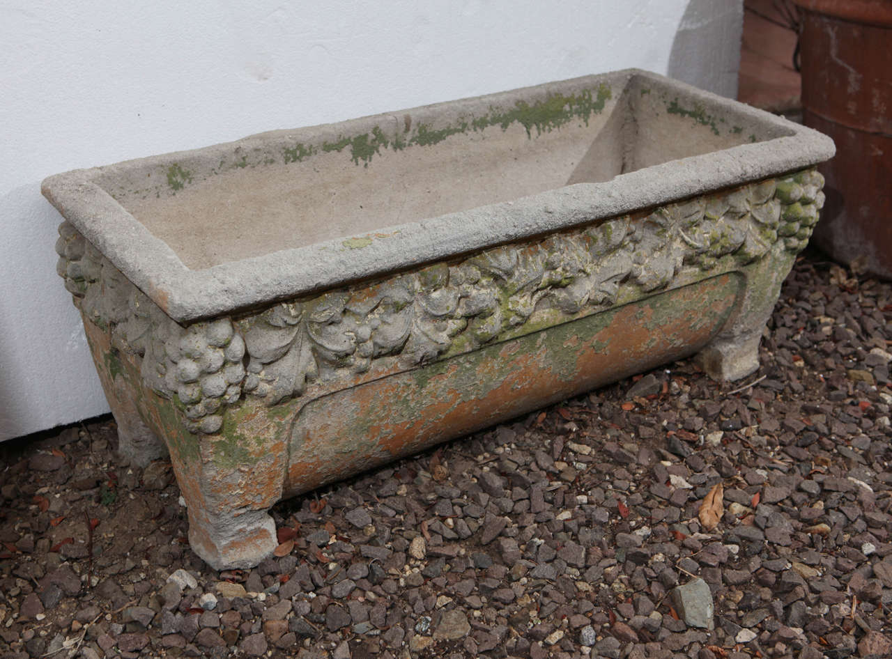 Large vintage 30's footed garden trough with floral design in relief at upper edge.
Original patina.