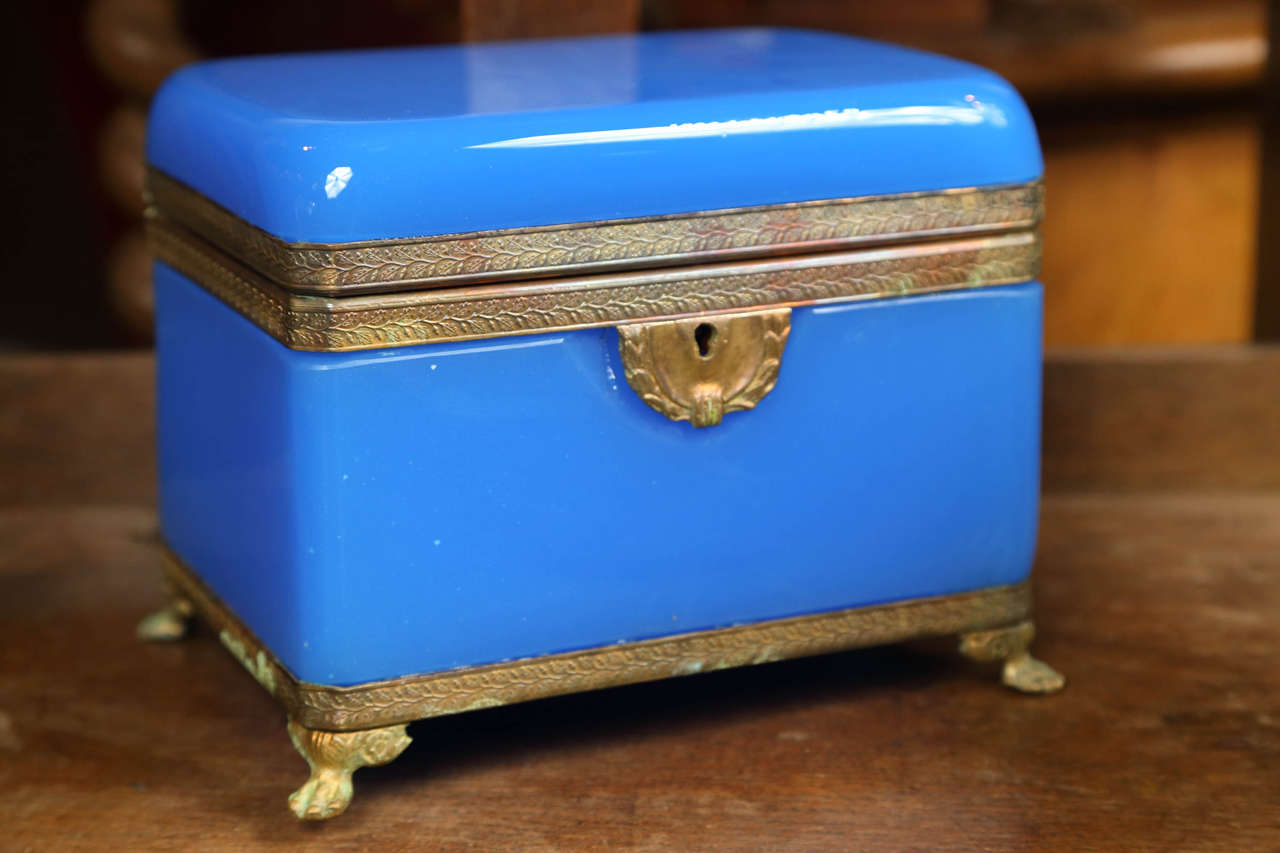 A 19th Century French opaline blue box with bronze mounts and feet having original key.