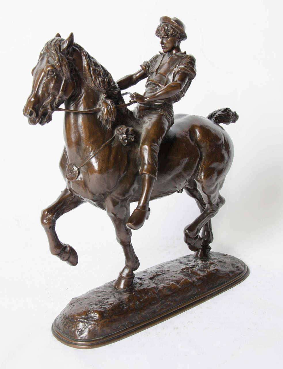 Cheval Monté Privé by Emmanuel Fremiet (1824-1910). A stunning rich brown patinated study of a young man riding an impressive stallion. Superb detail and condition. Set onto a naturalistic, integral plinth.

French, circa 1880, signed E. Fremiet