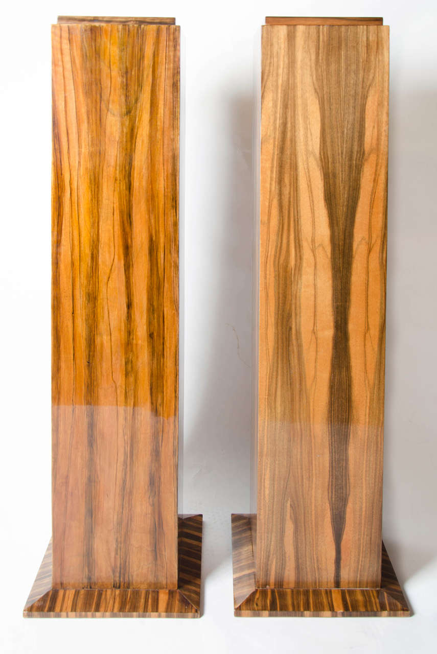 A Pair of Art Deco column pedestals in macassar ebony  veneers. Wonderful original condition.<br />
<br />
French, circa 1930, H 118cm, Top 25 x 25cm, Base 34 x 34cm