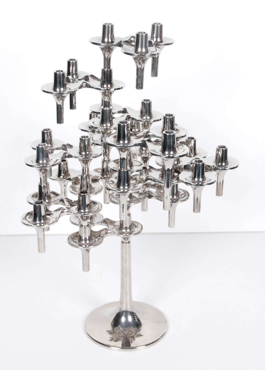 A 14 piece sculptural modular candelabra by Nagel. Can be configured in a variety of ways. Dimensions are as pictured.