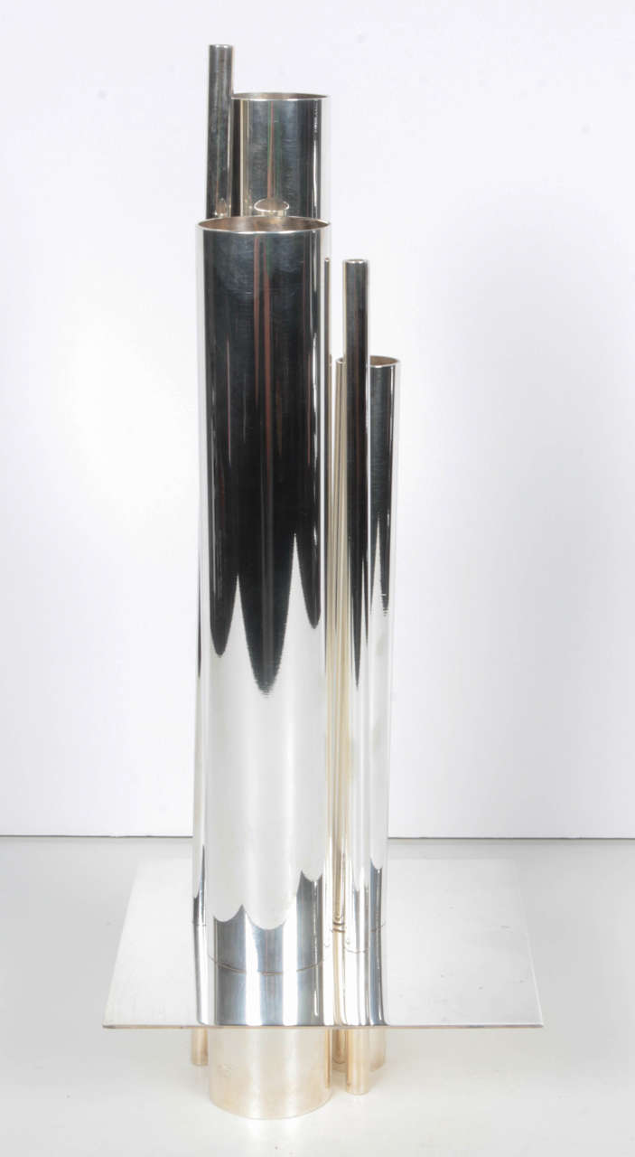 A silver plated tubular vase by Gio Ponti for Christofle.