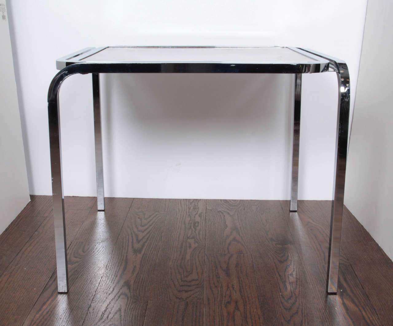 A chrome and burlwood side table.