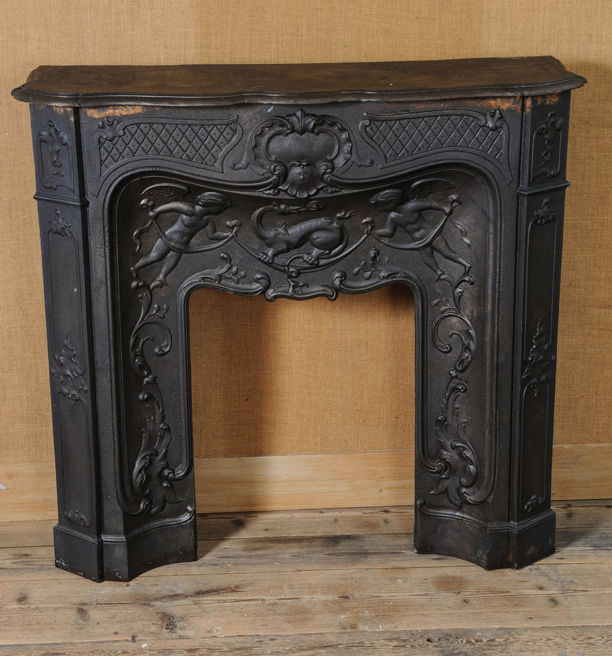 A rare 19th Century French gunmetal polished cast iron Pompadour fireplace / mantel piece with original insert / interior.