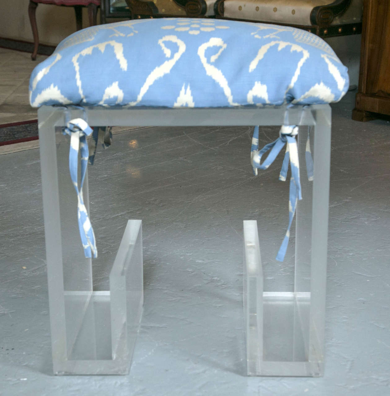 Pair of solid Lucite modern benches manner of Karl Springer. This fine pair of double U-shaped benches were purchased from a NYC apartment and featured in a magazine lay out in the late 1970s. Having every attribution to Springer we simply do not