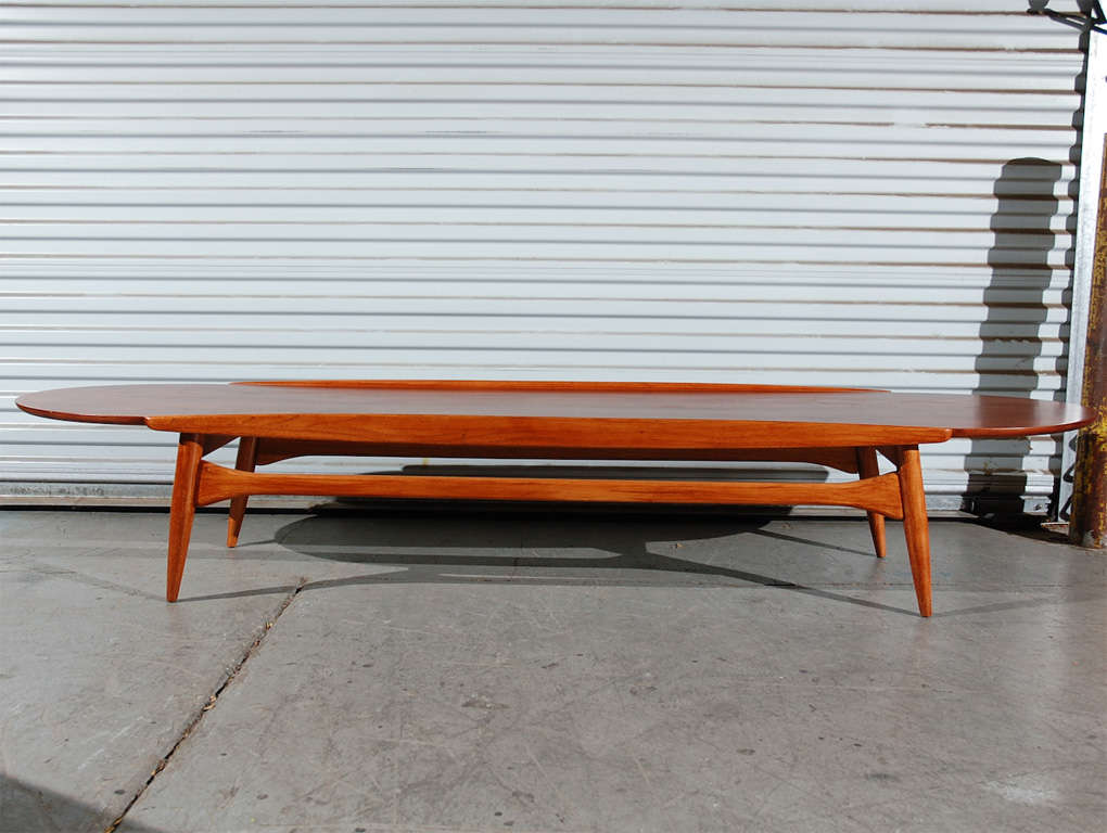 mid century surfboard coffee table on four legs with crossbars