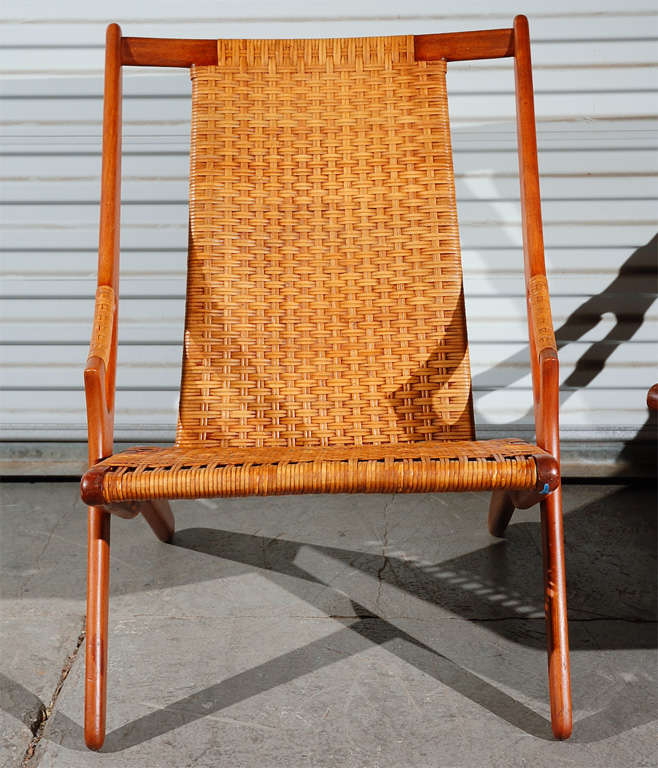 Pair of Arne Hovmand-Olsen teak easy chairs, with back and seats in woven cane.