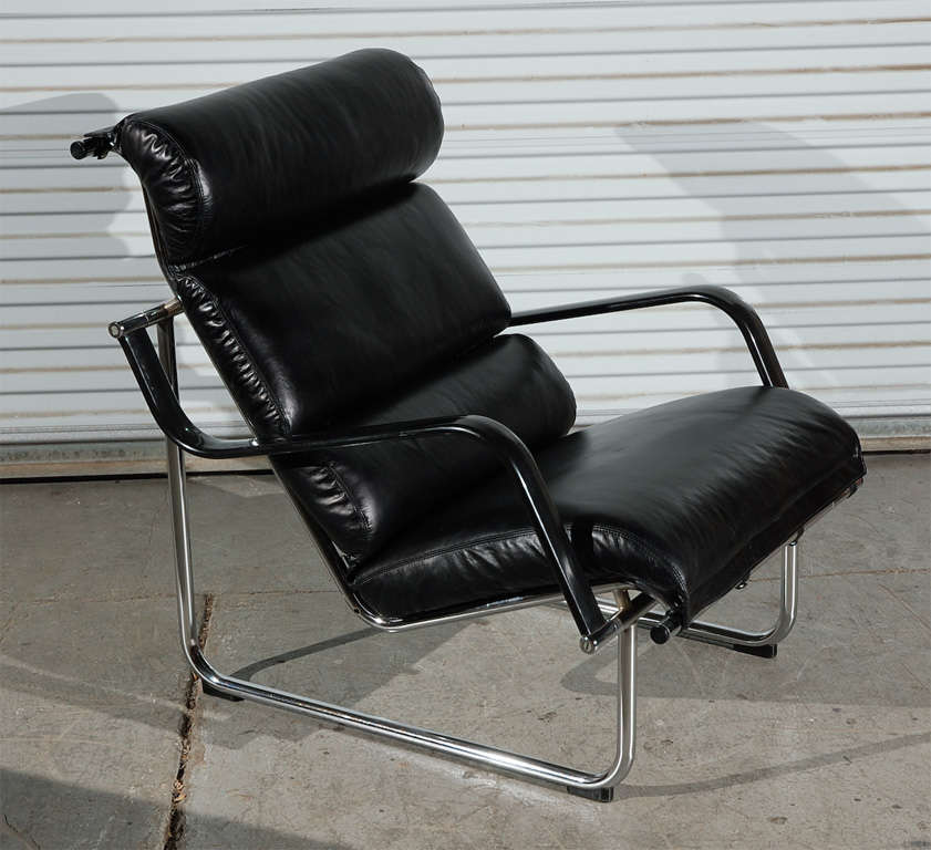 Pair of Yrjo Kukkapuro 'Remmi' Chairs and Footstools in chrome plated tubular steel and black plastic