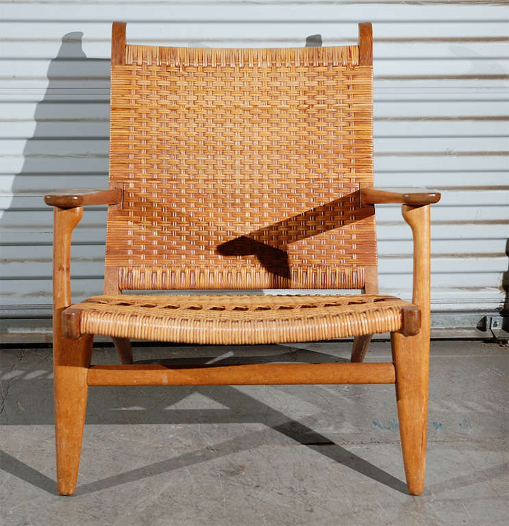 Denmark: Hans Wegner oak and cane armchair, model # CH27