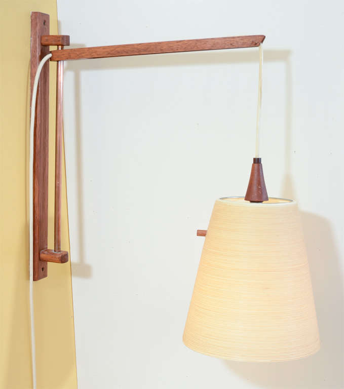 Fantastic, fully adjustable wood and copper wall lamp with string/fiberglass shade.  The lamp is beautifully detailed and executed- it even has a walnut rod for the dimmer switch. Located at ABC Home 646-602-3519.