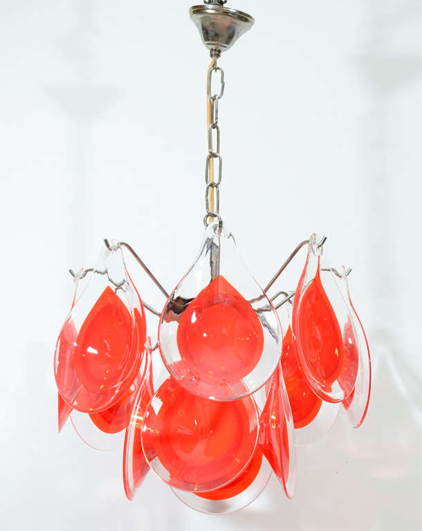 Colorful and playful small chandelier with red and clear tear drop shaped art glass crystals. The crystals have gradations of reds/oranges. Please contact for location. Offered by Las Venus by Kenneth Clark, New York City.