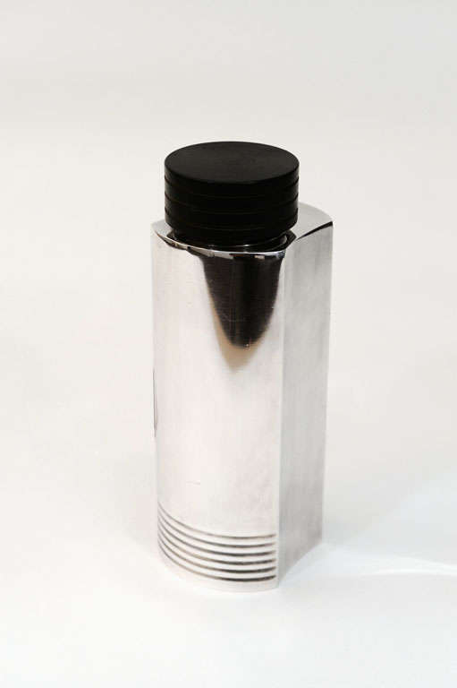 Nickel-plated brass cocktail shaker made from four parts of a circle. The speed lines match the horizontal lines on the top cover. By Folke Arstrom for Guldsmeds Aktie Bolaget.  Signed GAB NSALP.