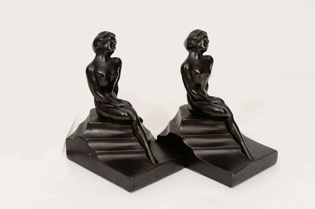Nuart Pair of Bookends. Nude Sitting on Steps.