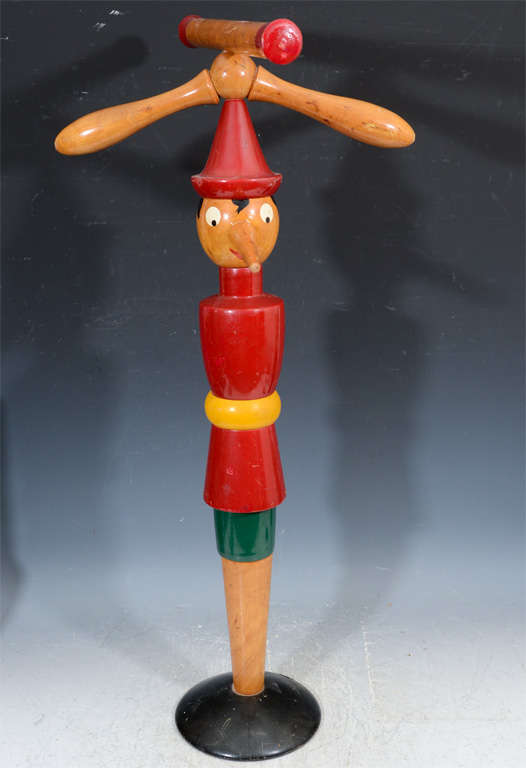 A hand crafted and painted wooden child's coat rack or valet in the shape of Pinocchio.

Reduced from: $1,800