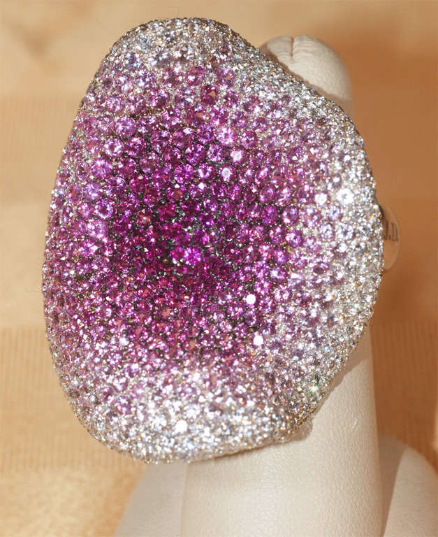 A beautiful creation by the Italian master designer Carlo Pamliero.  Featuring a flowing design in micro-pave' set diamonds and colored sapphires in graduated hues and tones of pinks and purples.