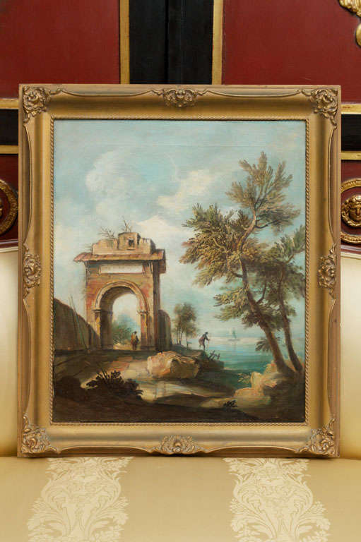 A traveler examines a prominent arched entry as his companion explores the remnants of a waterside port at an ancient site; in an acanthus and molded gilt frame.