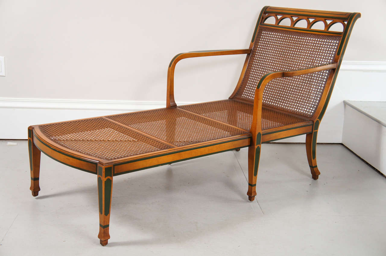 A great Edwardian looking satinwood chaise. The chaise has the original finish and caning. The chaise has the 40's upholstered seat and back cushions, both in good condition with no tears or stains.Given the age of the caning I would recommend
