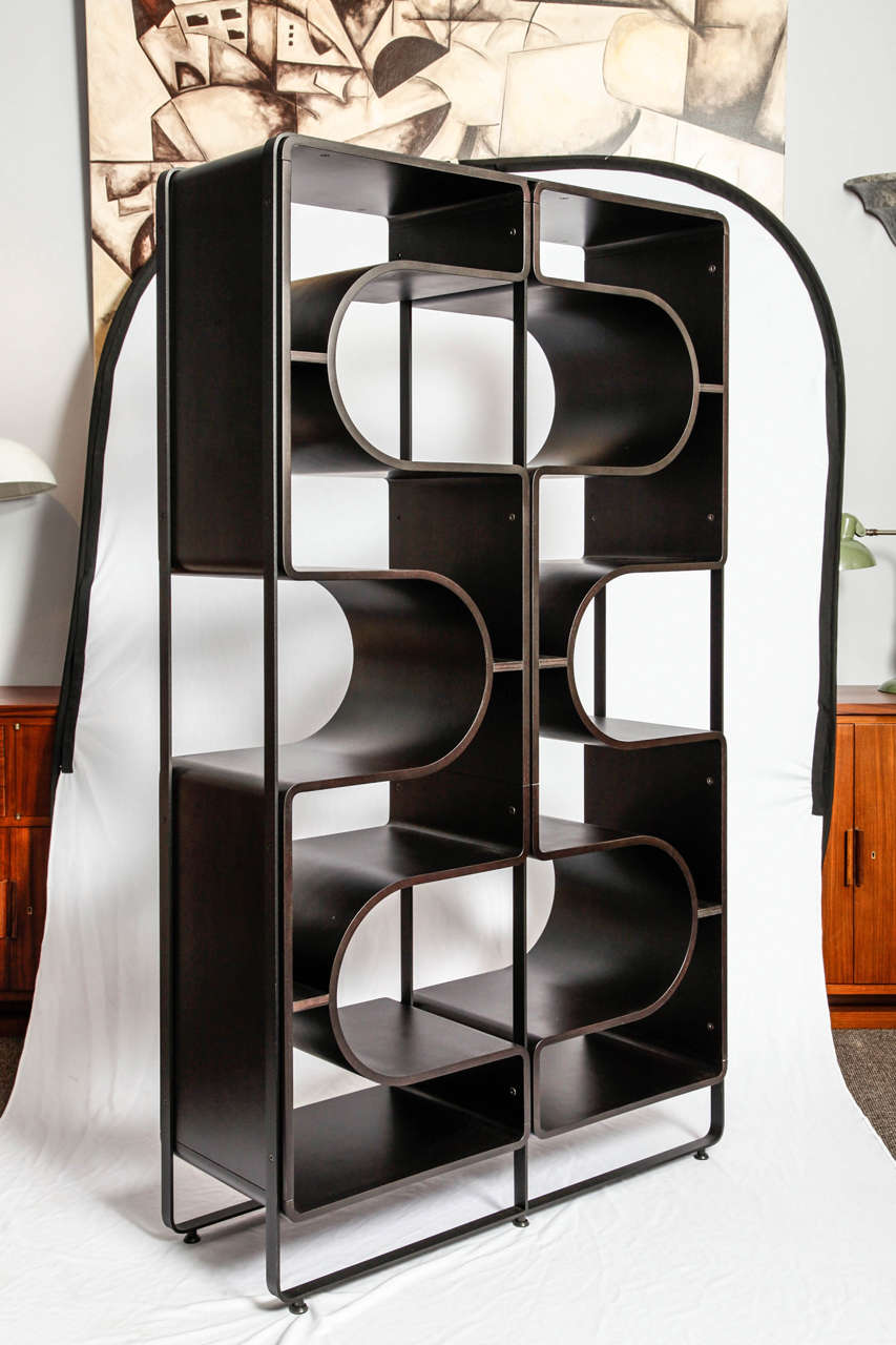 Italian origin wooden modernist bookcase.It can be used as a decorative separation between two pieces.Very elegant.