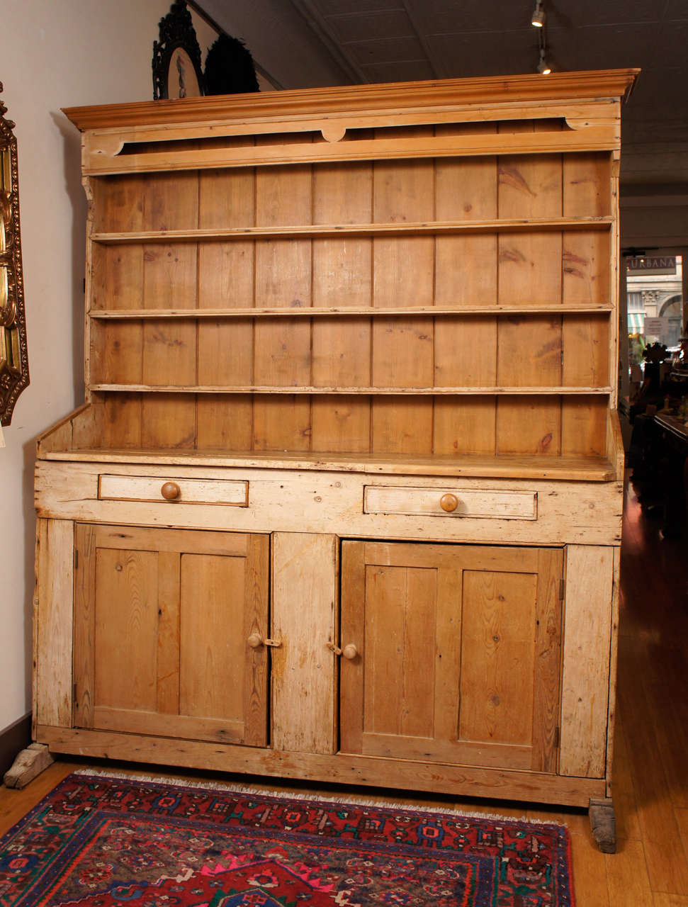 This nice old piece was probably made as two separate objects used in tandem but in the early part of this century were reconfigured to become one single piece . The construction is pine throughout and shows country carpentry consistent with its use