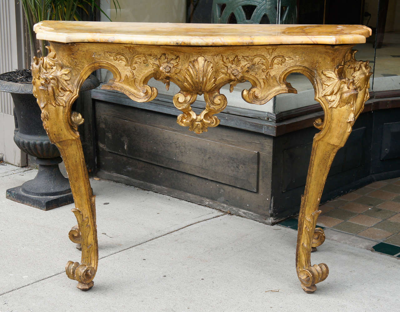 This Roman table made in the Baroque taste is a fine example of the type of furniture made for stylish and demanding customers in the eternal city. Made in the late 17th century to early 18th century of carved and gilded wood the gilded surface and