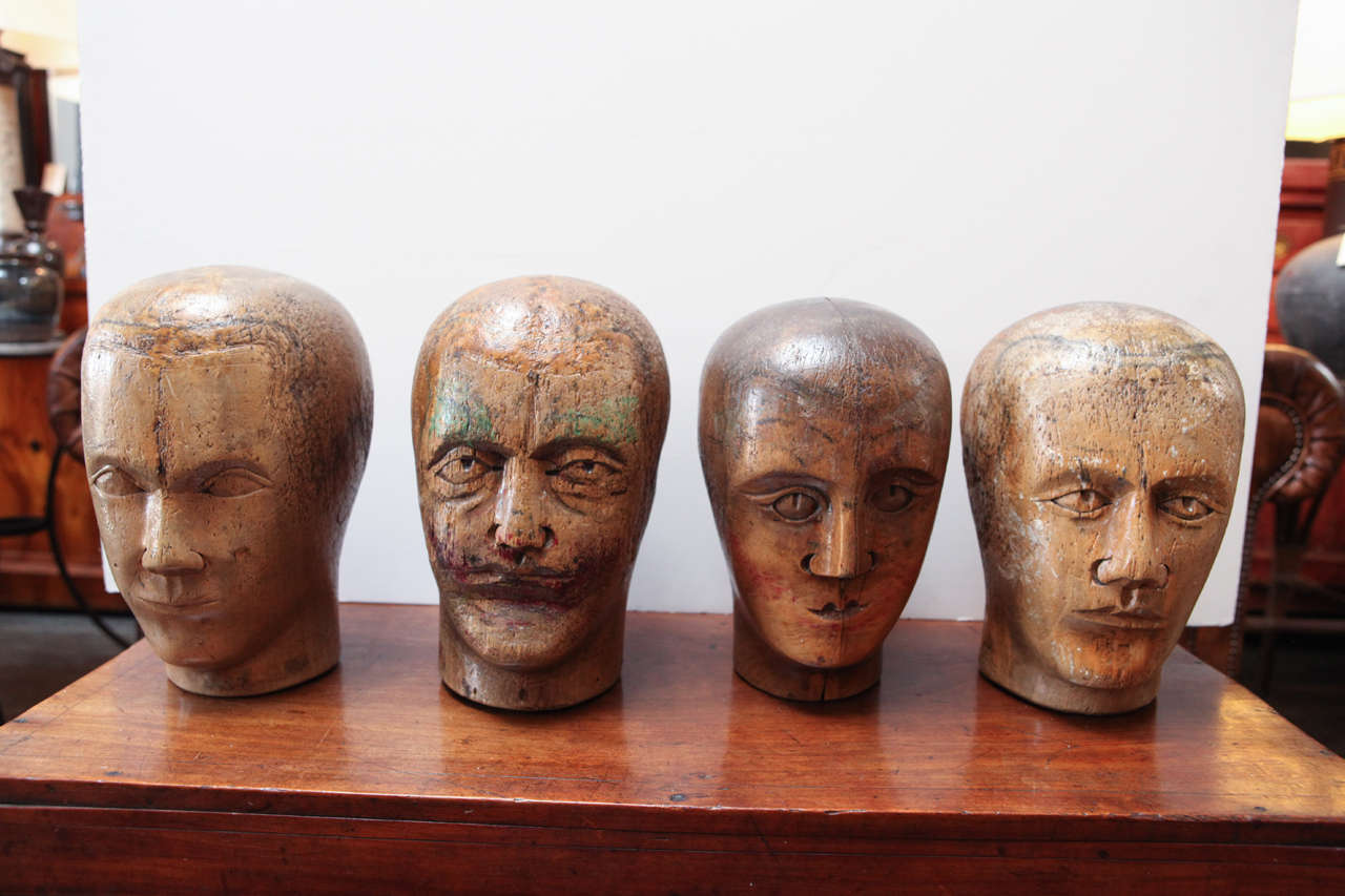 Unique wood carved heads each with individual expression, texture and paint. 
These measure from 6 1/2