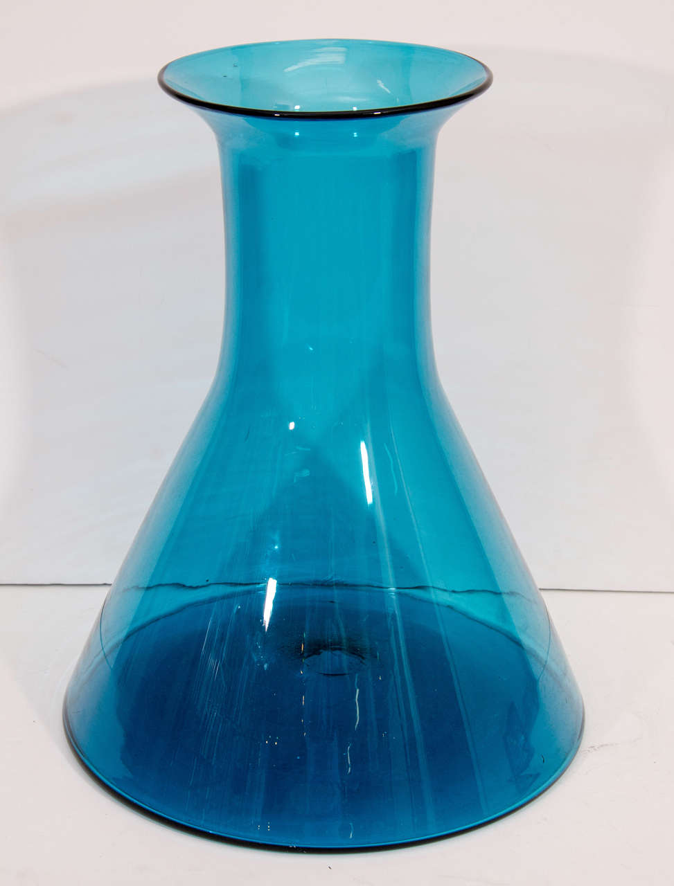 A vintage large electric blue glass vase by Wayne Husted for Blenko Glass.