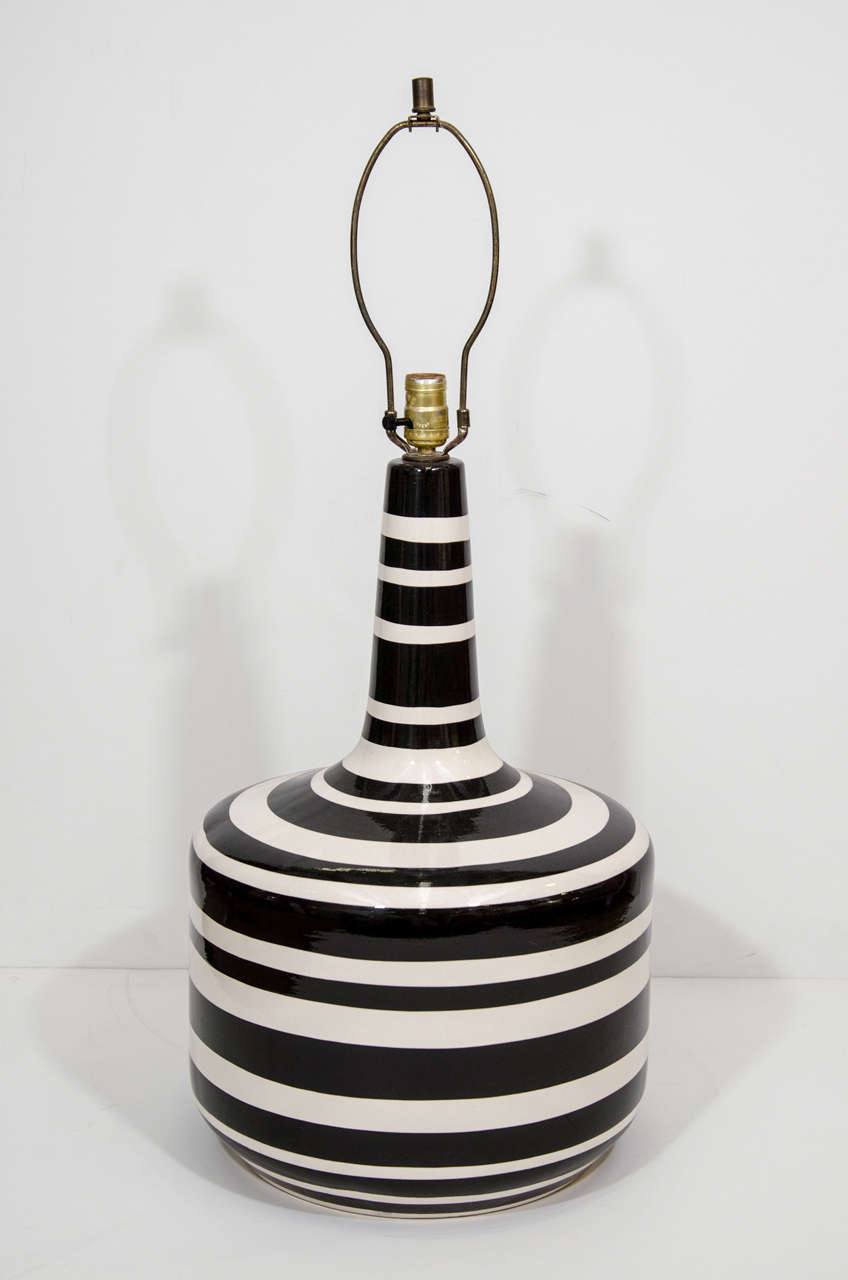 A vintage pair of large Italian glazed ceramic table lamps in black and white stripes.