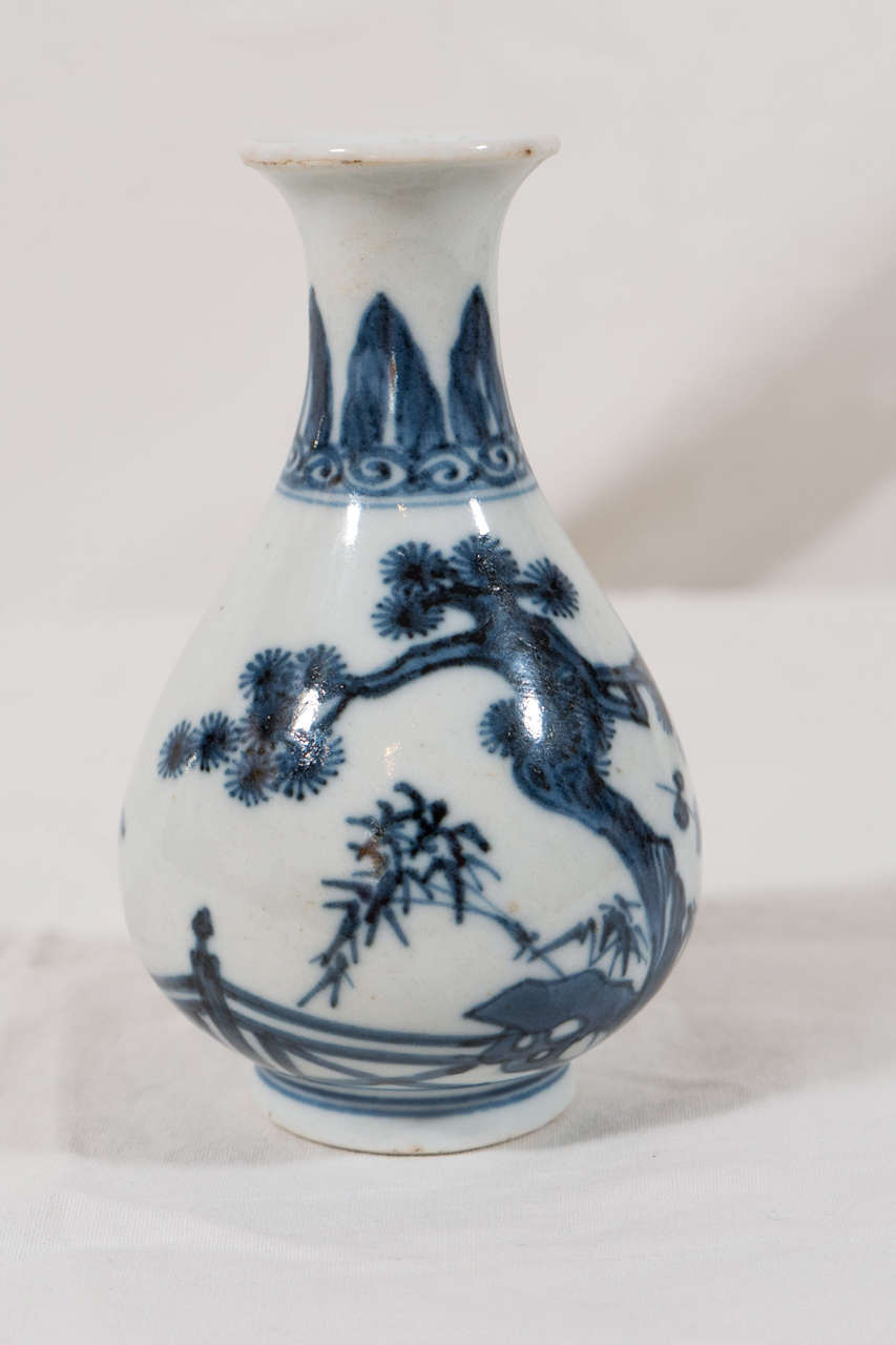 This gem like, bottle shaped vase is decorated with pine, plum (prunus), bamboo, and banana trees each of which has symbolic meaning in Chinese tradition. 