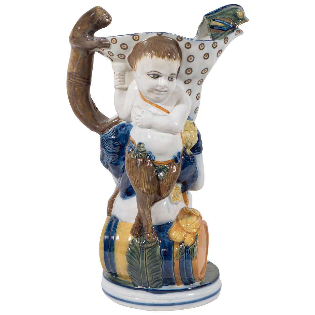 A Bacchus and Pan pottery relief molded Toby jug. With exceptionally detailed modeling of the figures: Te main figure of Bacchus is seated on a wine cask, a monkey standing on his shoulder becomes the handle for the pitcher, while the fish Bacchus