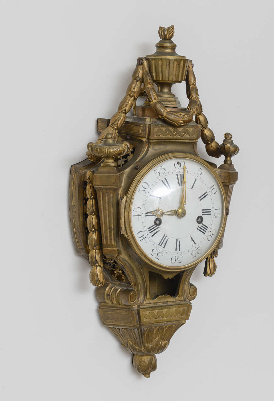 Outstanding example of an 18th century French cartel clock with original parts and patina. Signed by maker on the interior.