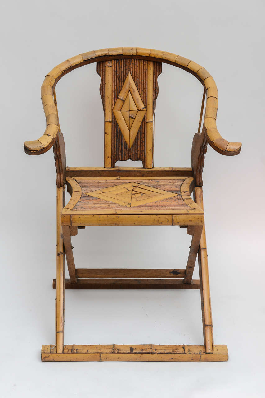 Intricate and beautiful Huanghuali Jiaoyi style folding bamboo chair.