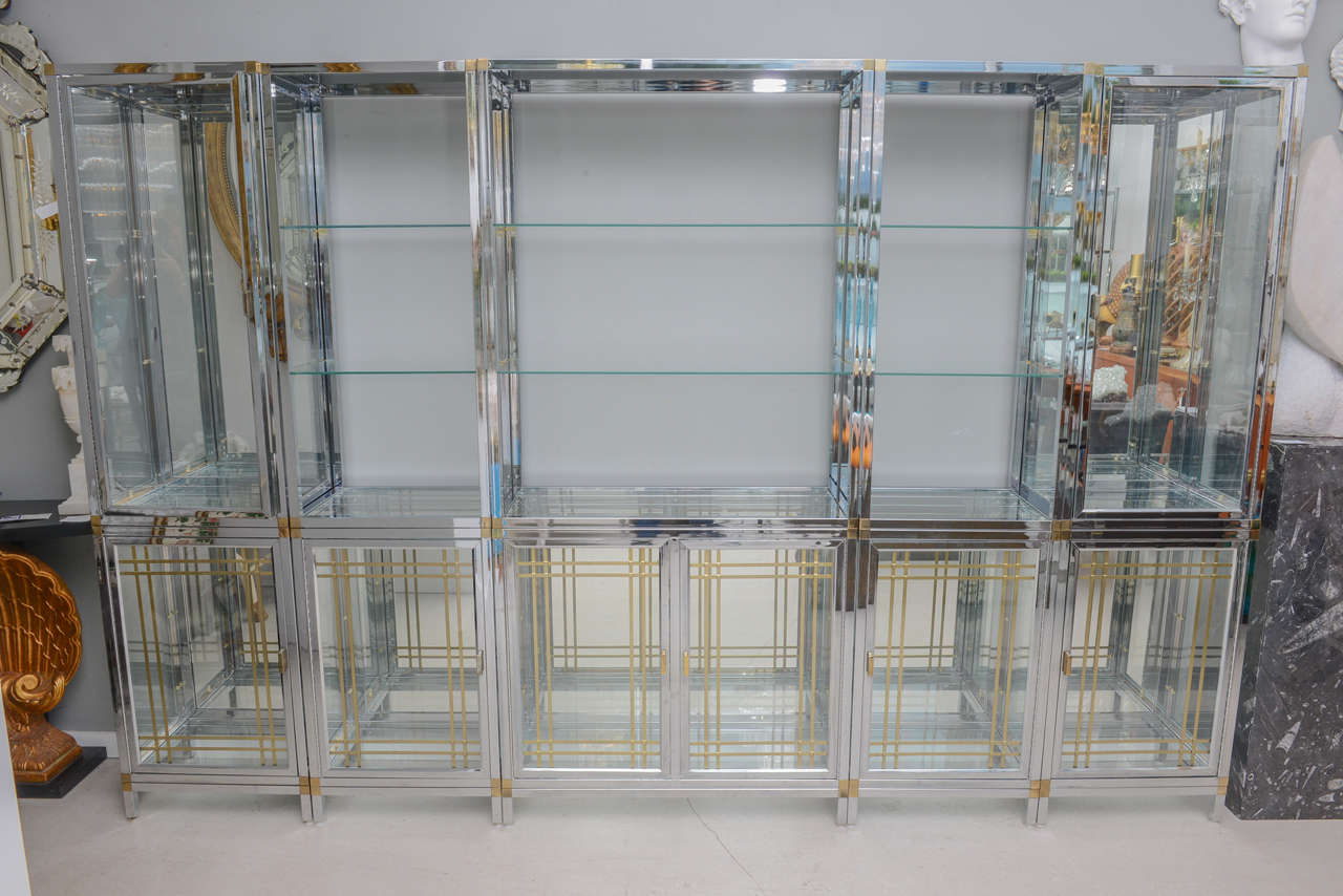 Retro chrome and brass wall unit comprising five components. The system makes a wonderful shop display for objects. The two-tone system has commercial or residential appeal.