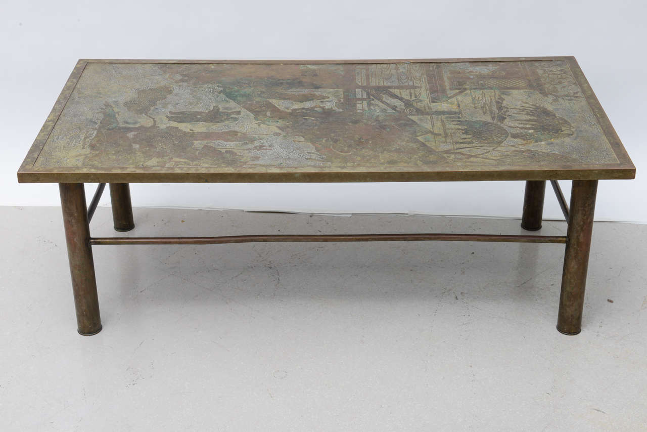 Vintage rectangular bronze coffee table by Laverne. The table has figural motif acid etched with atmospheric landscape.