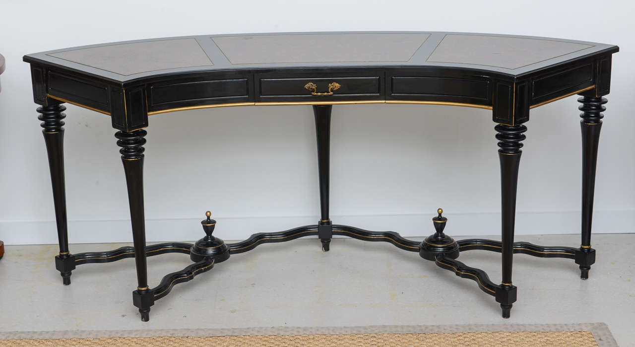 Classical demilune desk with single drawer and curvilinear stretcher. Attractive from all angles the desk may be floated in a room.