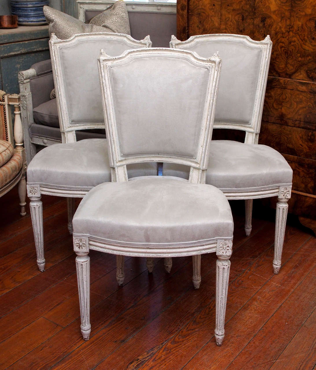 Set of 12 dining room chairs late 19th century, freshly painted  in pale grey and white  and newly upholstered in a grey velvet fabric.