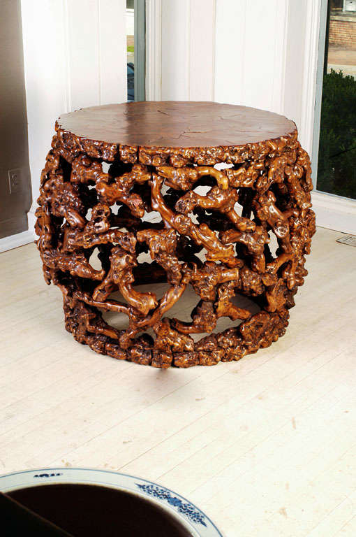 Exceptional drum shaped center table constructed from the Chinese Vine Root with a Burlwood Inlay Top.