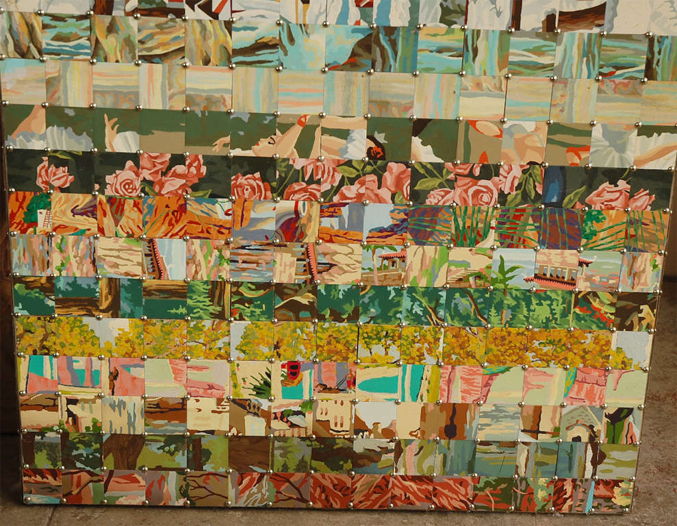 REVERSIBLE LEANING PANEL MADE FROM CUT-UP PAINT-BY-NUMBER PAINTINGS. ONE SIDE IS A STRIPE LAYOUT. THE REVERSE IS RANDOM CHECKERBOARD STYLE. THE LITTLE SQUARES ARE CAREFULLY ATTACHED WITH NAILHEADS.IT IS MOUNTED ON A CUSTOM WOOD PANEL