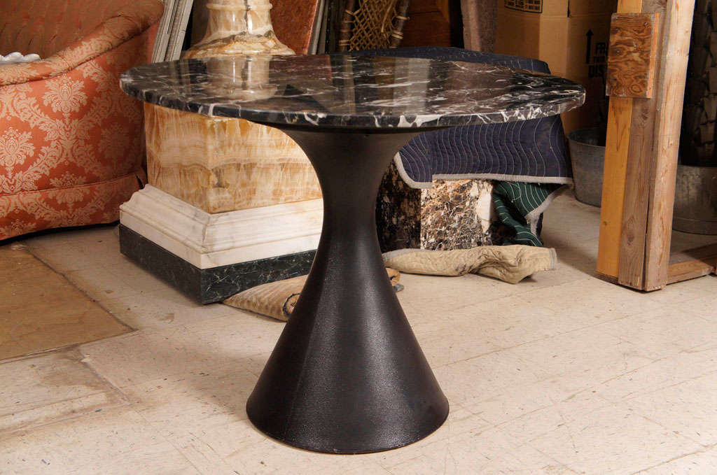 This attractive and very usable table from the mid 60's has all the style and functionality of the modern movement. Made from marble and industrial resin the base is very heavy and can be used indoors or out. The top, a finely and dramatically