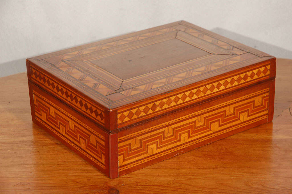 An appealing 19th century American parquetry keepsake box. The ideal accessory that will add interest and be useful in your setting. Jefferson West Antiques offer a selection of antique decorative accessories, furniture, mirrors, lighting and