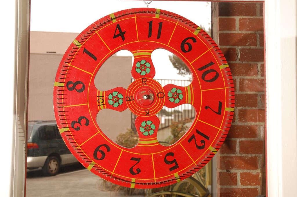 Brightly colored, hand painted, American, circa 1940's gaming wheel. Nice size that will display and add interest to most settings. Jefferson West Antiques offer a selection of antique and vintage decorative accessories, furniture, mirrors, lighting