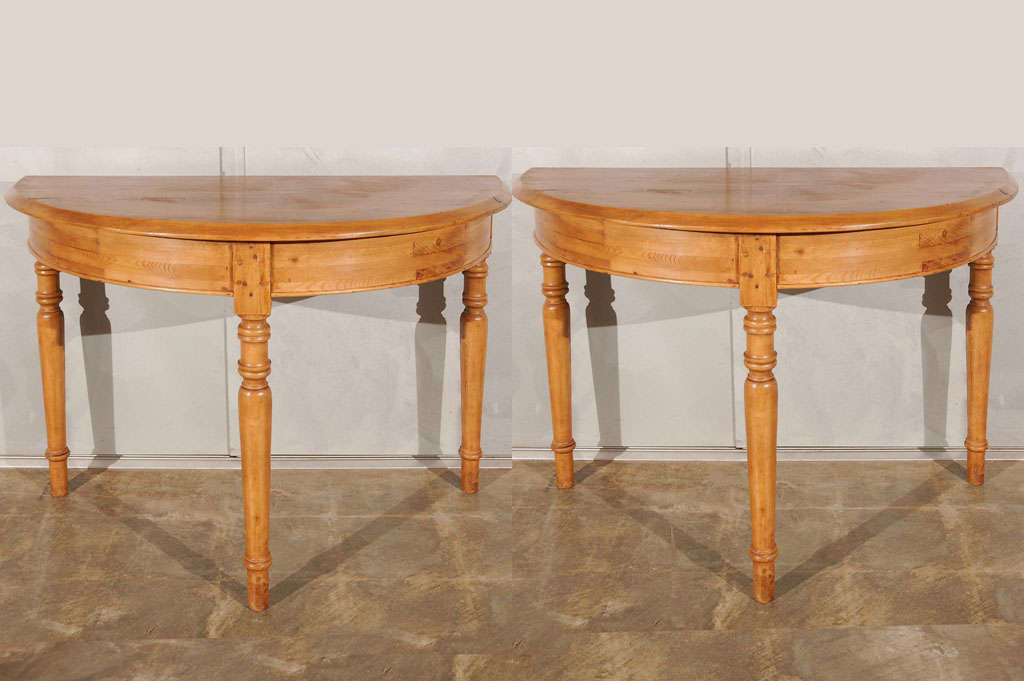 A pair of Swedish 19th century demi-lune tables. They are an attractive pair that will show well in all types of settings and make a good statement. Jefferson West antiques offer a wide selection of furniture, lighting, mirrors, smalls and