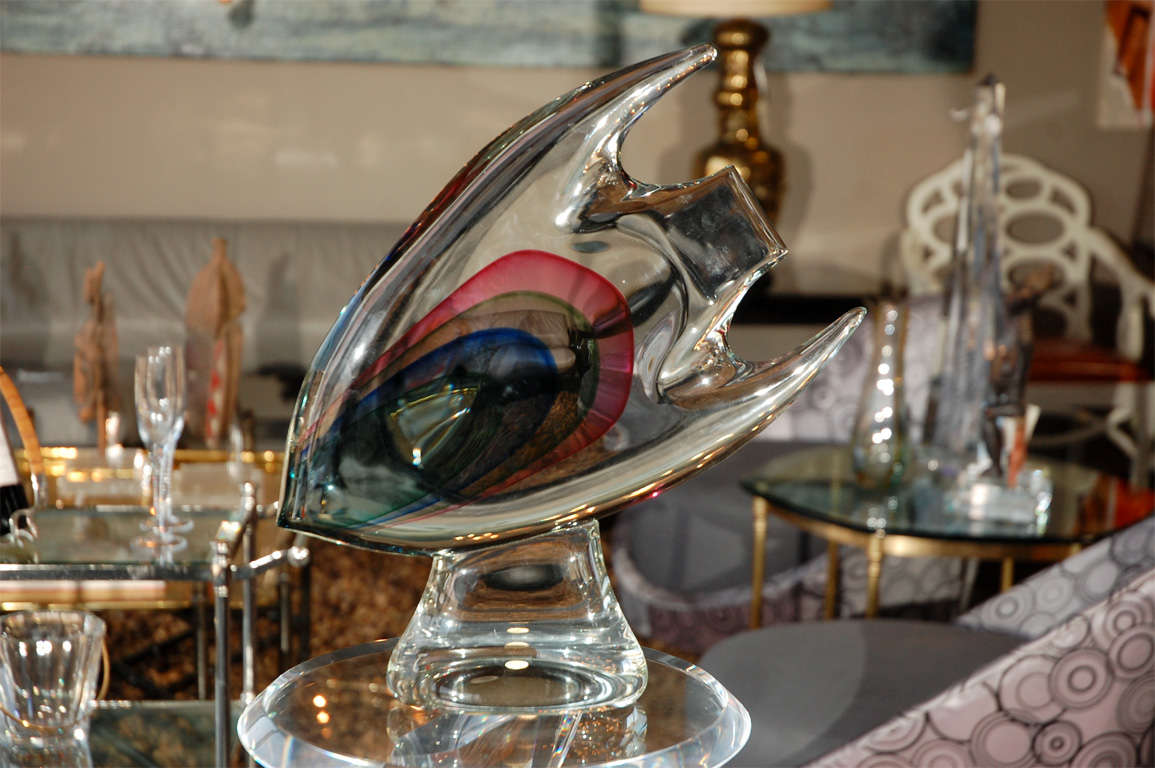 An impressive Murano glass fish with a multi colored design. Signed on the bottom but hard to read -- it says something like--- 