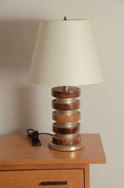 Banded walnut and brass table lamp with brass fittings. Newly rewired for US with black twisted silk cord. Shade is not included.
