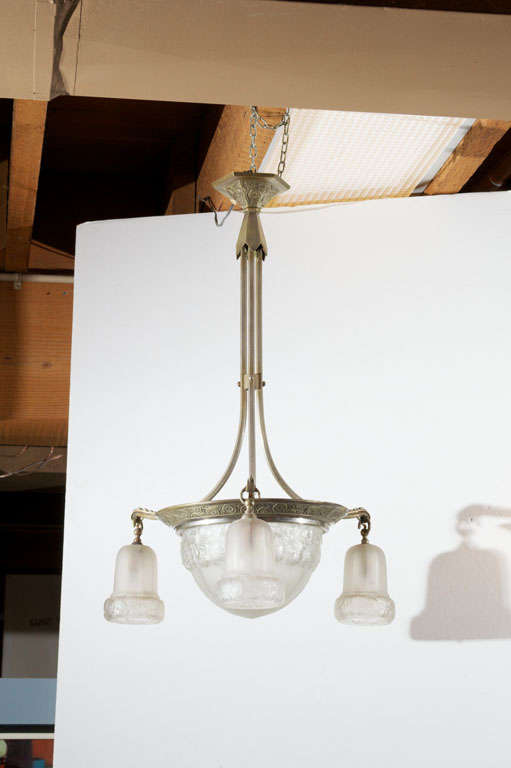 French Art Deco nickle plated bronze and translucent glass hanging light fixture;  with center glass pendant and three shades.