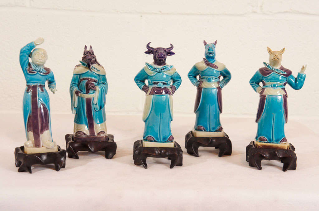 Here is a whimsical set of ceramic Chinese Zodiac Figurines with ebonized stands.