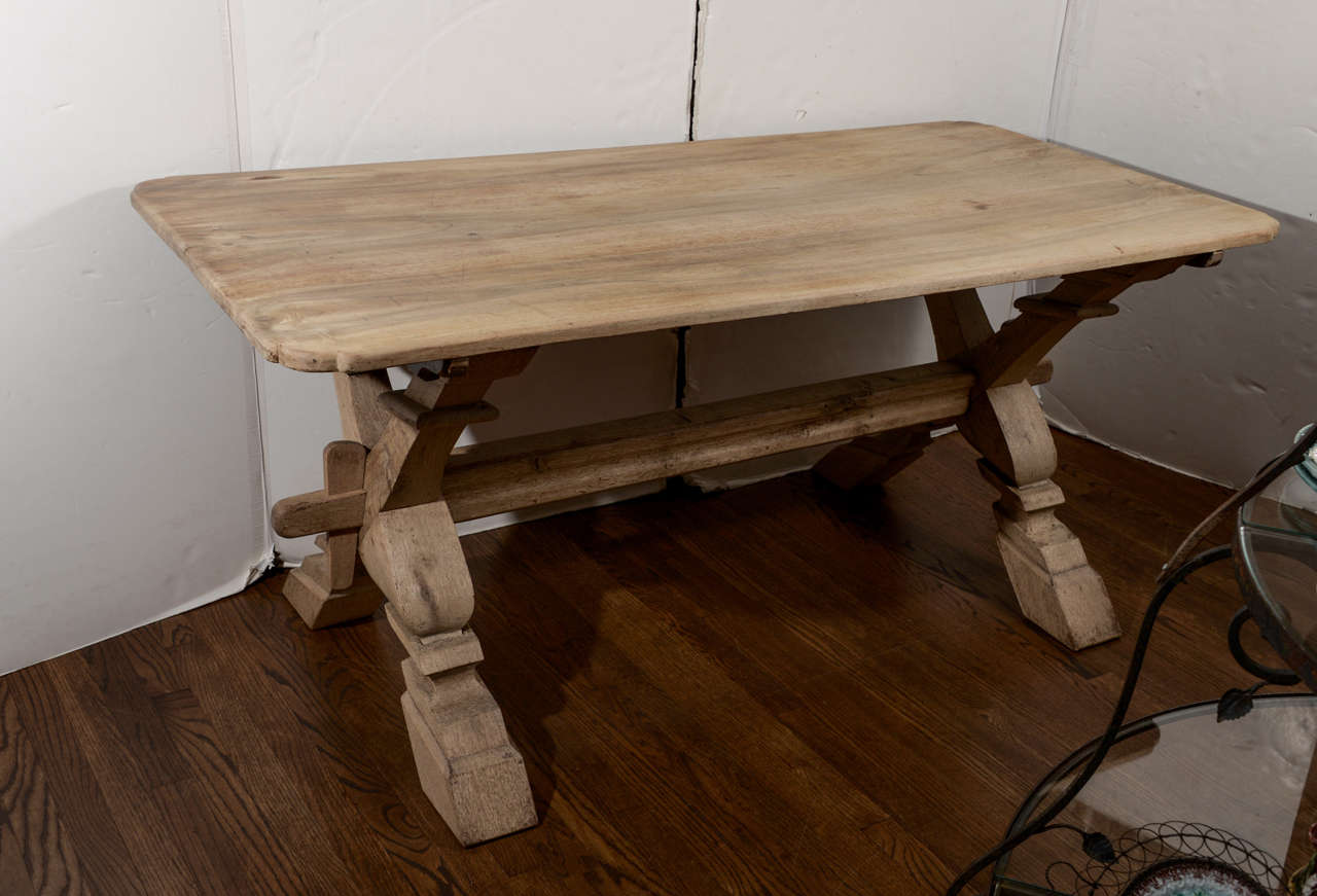 Beautifully detailed trestle base supports a three plank top with notched corners. Table size is perfect for a breakfast area or a smaller dining room.
