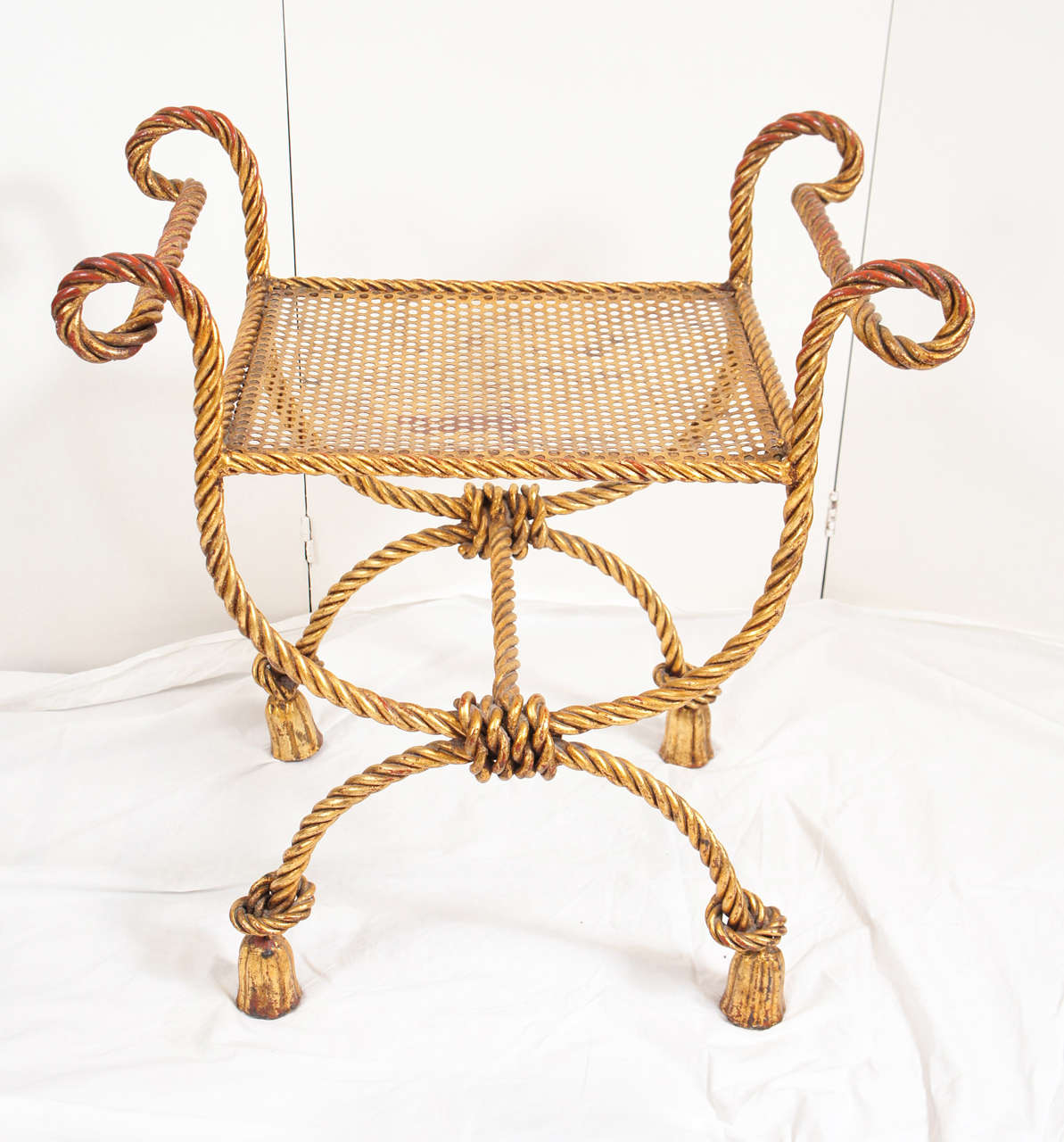 Gilded metal, rope patterned bench with tassel feet. Probably French or Italian, circa 1950