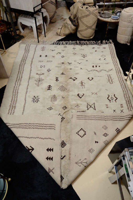 Beautiful Moroccan rug. Hand-loomed with a deep pile. Cream with brown and taupe patterns.  This rug is SOLD. We have other rugs, please contact us.