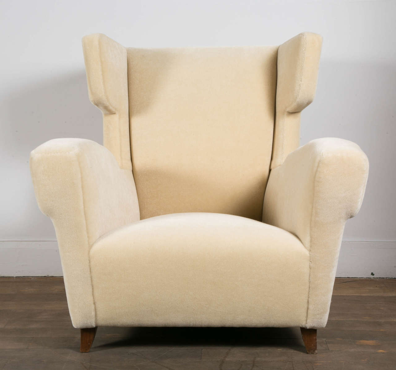 A pair of lounge chairs, re-upholstered with a beautiful ivory velvet. 
In the style of Paolo Buffa.
Italy, circa 1950.